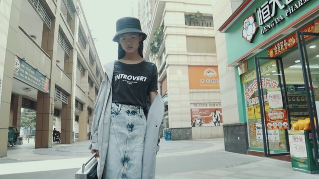 Video Reference: Building, Hat, Infrastructure, Street fashion, Fedora, Eyewear, Sleeve, Waist, Sun hat, Architecture
