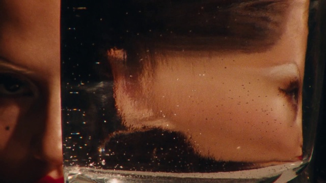 Video Reference: Hairstyle, Liquid, Human body, Jaw, Flash photography, Fluid, Eyelash, Beard, Material property, Art