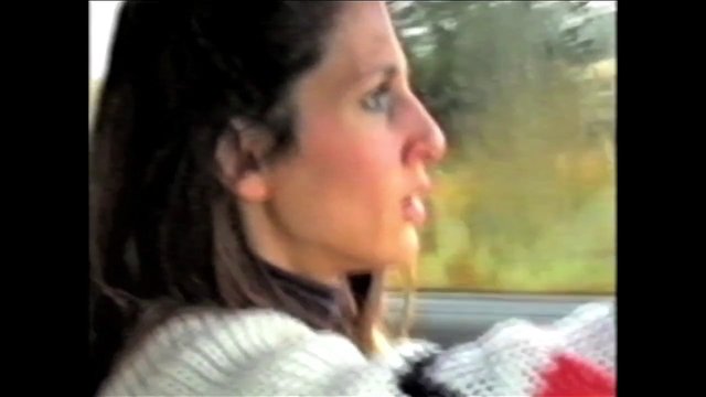 Video Reference: woman, profile, car, passenger, window, close-up, indoor, travel, motion blur, portrait, side view, vehicle, outdoor background