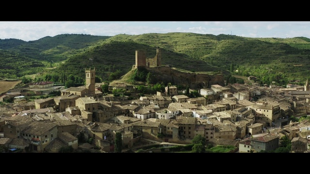 Video Reference: Sky, Building, Mountain, Natural landscape, Landscape, Mountainous landforms, Plant, City, Hill, Tree