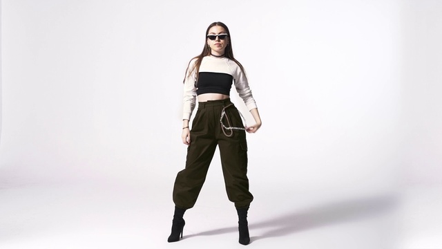 Video Reference: Outerwear, Shoe, Arm, Shoulder, Leg, Latex clothing, Human body, Flash photography, Neck, Knee