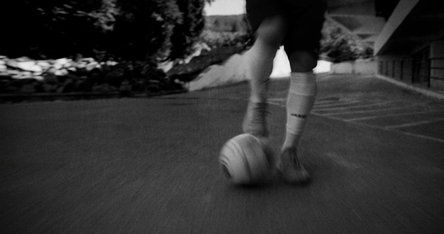 Video Reference: Leg, Sports equipment, Human body, Ball, Wood, Knee, Flash photography, Style, Black-and-white, Floor