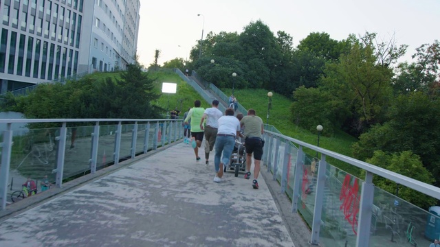 Video Reference: Plant, Sky, Building, Tree, Fence, Road surface, Thoroughfare, Asphalt, Sidewalk, Leisure