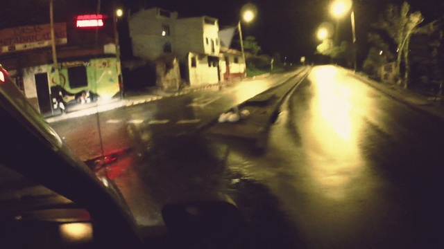 Video Reference: Automotive lighting, Road surface, Asphalt, Street light, Mode of transport, Headlamp, Thoroughfare, Motor vehicle, Electricity, Tints and shades