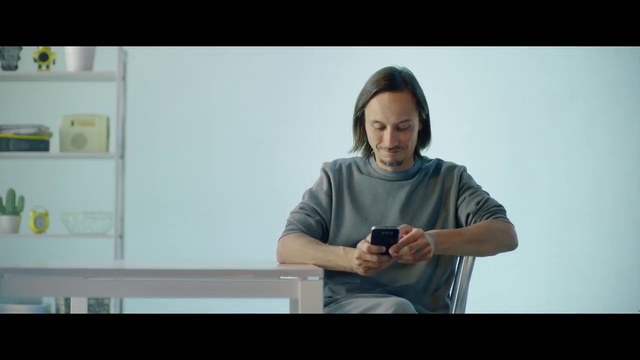 Video Reference: Hand, Arm, Human body, Sleeve, Gesture, Elbow, Flash photography, Font, Wrist, Gadget