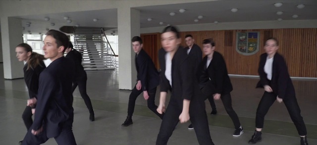 Video Reference: Trousers, Gesture, Collar, Blazer, Fashion design, Formal wear, Waist, Fun, Event, Uniform