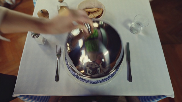 Video Reference: Tableware, Dishware, Plate, Kitchen utensil, Gesture, Serveware, Headgear, Table, Eyewear, Cutlery