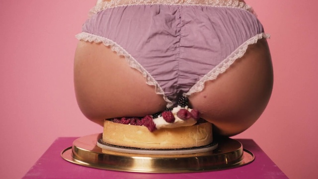 Video Reference: Glasses, Food, Dress, Helmet, Human body, Waist, Pink, Serveware, Headgear, Thigh