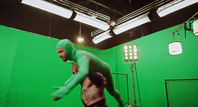 Video Reference: Green, Entertainment, Chest, Event, Barechested, Performing arts, Physical fitness, Magenta, Performance art, Room