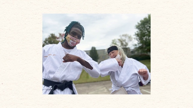 Video Reference: Sky, Gesture, Cloud, Happy, Smile, Martial arts uniform, Event, Eyewear, Fun, Tree