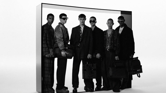 Video Reference: Sleeve, Standing, Collar, Style, Overcoat, Font, Fashion design, Blazer, Formal wear, White-collar worker