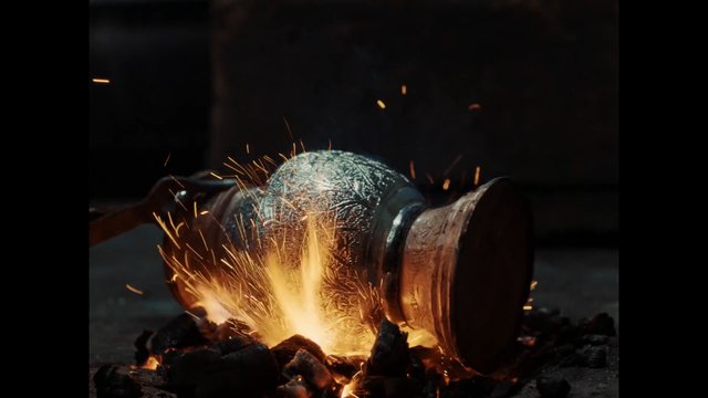 Video Reference: metal, sparks, forge, welding, heat, fire, industrial, close-up, dark background, molten, embers, workshop, manufacturing, metalworking