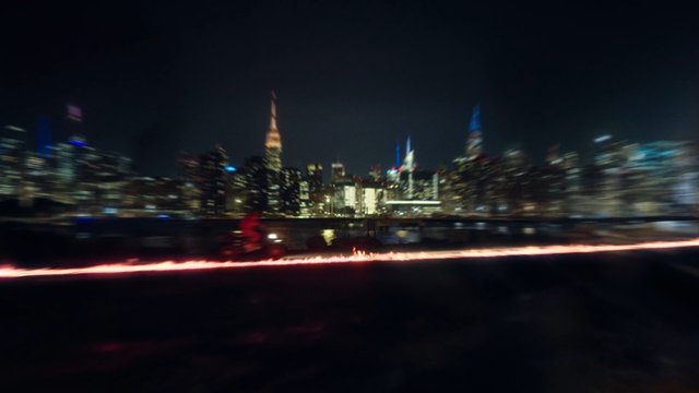 Video Reference: night, city skyline, waterfront, city lights, blurred, motion blur, fire, light trail, urban, skyscrapers, nightscape, reflection, panorama