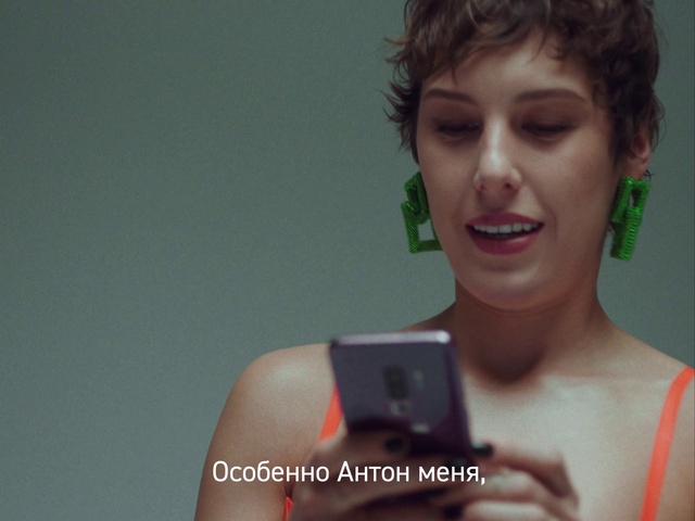 Video Reference: Skin, Lip, Smile, Hairstyle, Eyebrow, Eyelash, Mobile phone, Flash photography, Dress, Gesture
