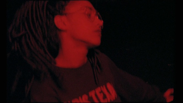 Video Reference: Mouth, Jaw, Flash photography, Neck, Sleeve, Music, T-shirt, Musician, Audio equipment, Entertainment