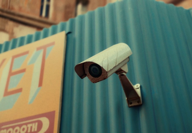 Video Reference: Surveillance camera, Wood, Font, Material property, Security, Gas, Signage, Bicycle handlebar, Street sign, Sign