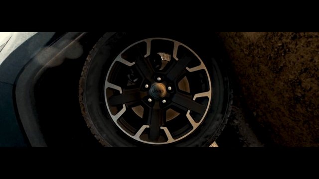 Video Reference: vehicle, wheel, tire, jeep, close-up, off-road, mud, alloy rim, car part, automotive, transportation, dark, outdoor
