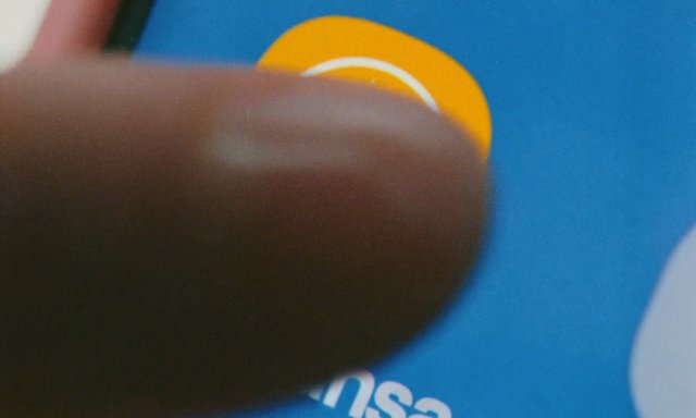 Video Reference: close-up, blurred, finger, hand, blue background, yellow circle, graphic, partial text, macro, abstract, screen, motion blur