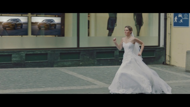 Video Reference: Wedding dress, Bride, Bridal clothing, Flash photography, Bridal party dress, Sleeve, Waist, Gown, Happy, Gesture