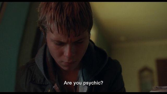 Video Reference: Cheek, Eyelash, Flash photography, Jaw, Neck, Facial hair, Darkness, T-shirt, Font, Bangs