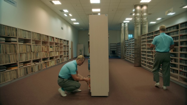 Video Reference: Bookcase, Shelf, Shelving, Flooring, Floor, Publication, Event, Ceiling, Building, Job