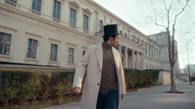 Video Reference: Window, Building, Dress shirt, Sleeve, Hat, Cap, Plant, Headgear, Blazer, Travel