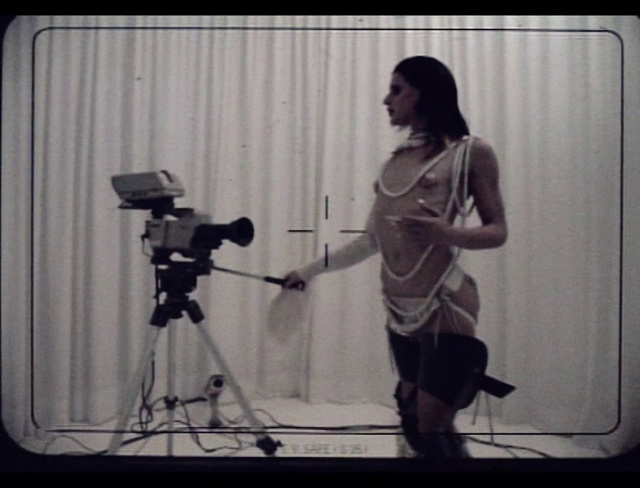Video Reference: Tripod, Flash photography, Camera accessory, Cameras & optics, Camera, Camera lens, Film camera, Microphone stand, Videographer, Cinematographer