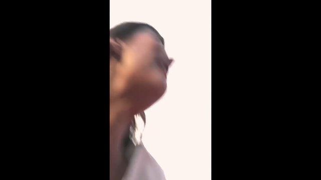 Video Reference: person, close-up, side view, blurry, portrait, indoor, background, face, shoulder, profile, motion blur, vertical video
