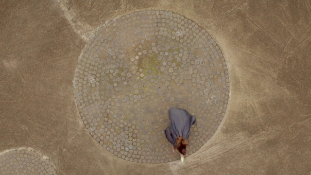 Video Reference: Flooring, Wood, Circle, Sand, Concrete, Landscape, Soil, Road surface, Art, Symmetry