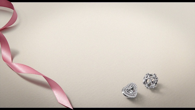Video Reference: Body jewelry, Silver, Petal, Natural material, Font, Circle, Jewellery, Cutlery, Wedding ceremony supply, Event