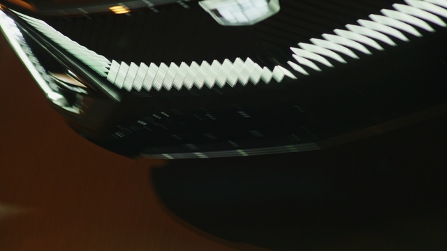 Video Reference: Hood, Grille, Helmet, Automotive design, Automotive lighting, Bumper, Automotive exterior, Tints and shades, Carbon, Office equipment