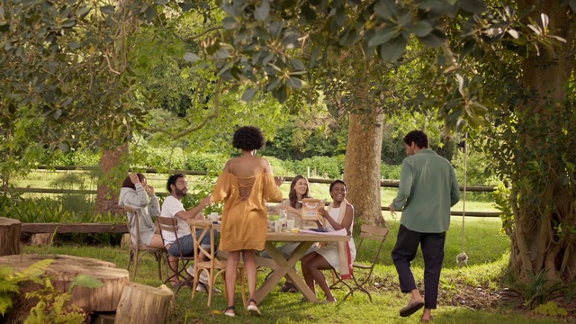 Video Reference: Footwear, Plant, Furniture, Table, Leaf, People in nature, Dress, Outdoor furniture, Tree, Sunlight