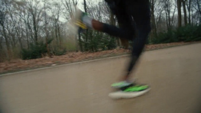 Video Reference: Sports equipment, Plant, Sky, Asphalt, Skateboarder, Tree, Skateboard, Outdoor recreation, Rolling, Morning