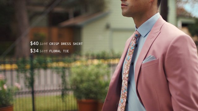 Video Reference: man, pink suit, dress shirt, floral tie, fashion, menswear, outdoor, formalwear, promotion, price text, lifestyle, style, pocket square, bokeh, retail, ad