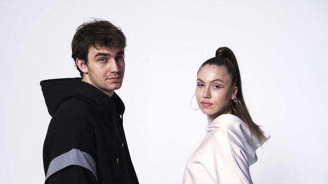 Video Reference: Flash photography, Neck, Sleeve, Gesture, Happy, Collar, Black hair, Fashion design, Formal wear, Waist