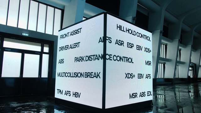 Video Reference: Rectangle, Font, Symmetry, Flooring, Gas, Facade, Space, Glass, Signage, Room