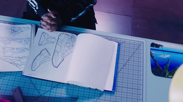 Video Reference: Blue, Automotive design, Azure, Textile, Purple, Writing implement, Architecture, Font, Art, Handwriting