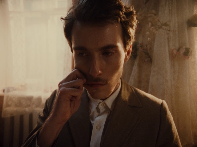 Video Reference: Forehead, Lip, Eyebrow, Dress shirt, Flash photography, Jaw, Beard, Gesture, Collar, Eyelash