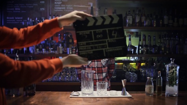 Video Reference: Drinking establishment, Drinkware, Tableware, Barware, Gesture, Alcoholic beverage, Drink, Bottle, Table, Alcohol