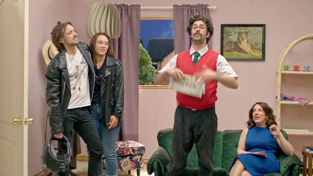 Video Reference: Blue, Picture frame, Social group, Smile, Curtain, Fun, Event, Chair, Entertainment, Luggage and bags