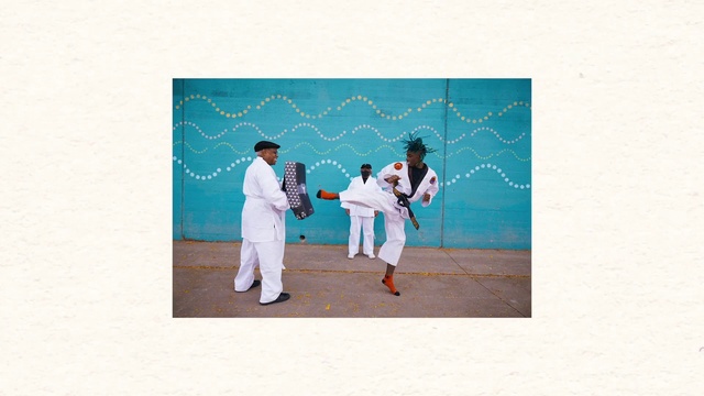 Video Reference: Sleeve, Gesture, Martial arts uniform, Happy, Art, Event, Uniform, Landscape, Font, Sports