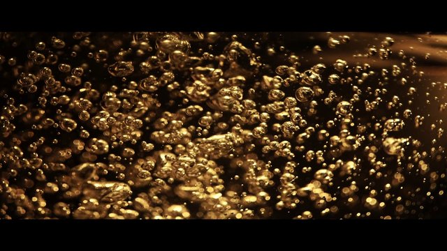 Video Reference: bubbles, golden, liquid, abstract, close-up, texture, sparkling, motion, dark background, macro, effervescence, glow