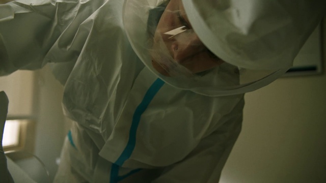 Video Reference: Arm, Human body, Textile, Sleeve, Gesture, Dress, Headgear, Personal protective equipment, Bridal accessory, Plastic bag