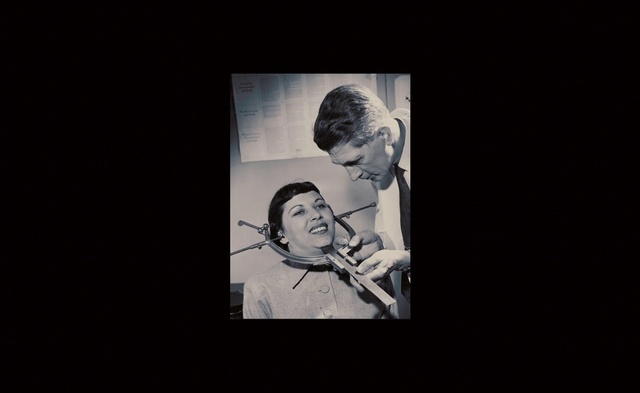 Video Reference: Smile, Flash photography, Gesture, Guitar, Musical instrument, Art, Font, Tie, Entertainment, Event