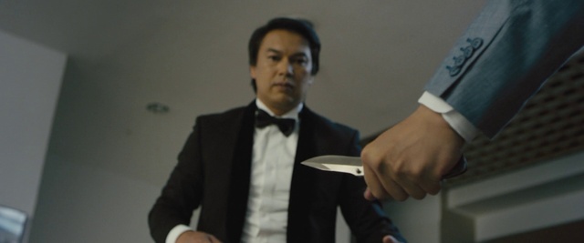 Video Reference: Dress shirt, Sleeve, Gesture, Collar, Suit, Blazer, Thumb, Formal wear, Event, White-collar worker