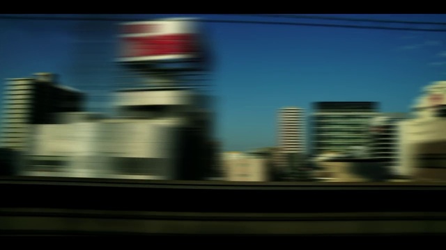 Video Reference: Sky, Building, Mode of transport, Automotive lighting, Skyscraper, City, Tints and shades, Tower, Tower block, Horizon