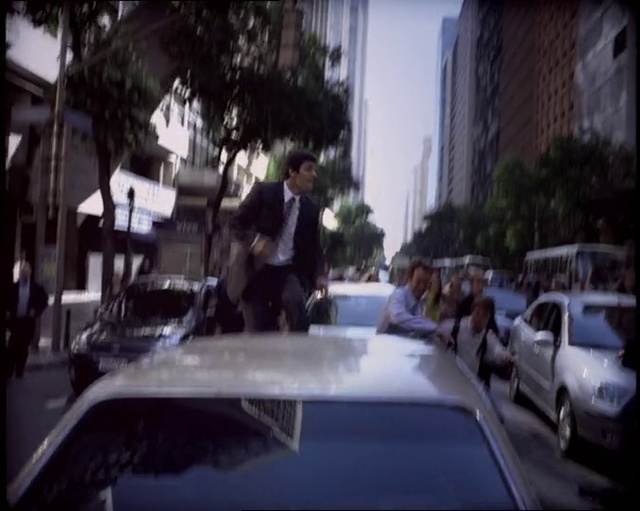 Video Reference: Building, Car, Vehicle, Hood, Motor vehicle, Tree, Automotive lighting, Automotive design, Automotive exterior, Personal luxury car