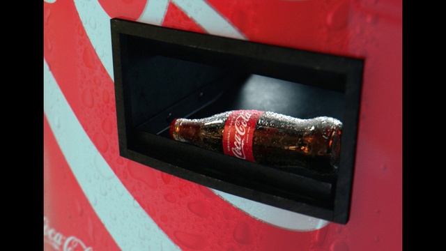 Video Reference: Bottle, Automotive lighting, Drink, Glass bottle, Font, Cola, Carbonated soft drinks, Automotive design, Tints and shades, Gas