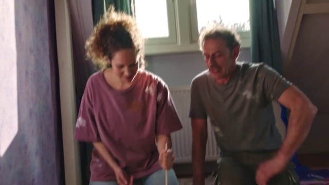 Video Reference: Clothing, Hairstyle, Shoulder, Mouth, Window, Sleeve, Gesture, Curtain, Fun, T-shirt