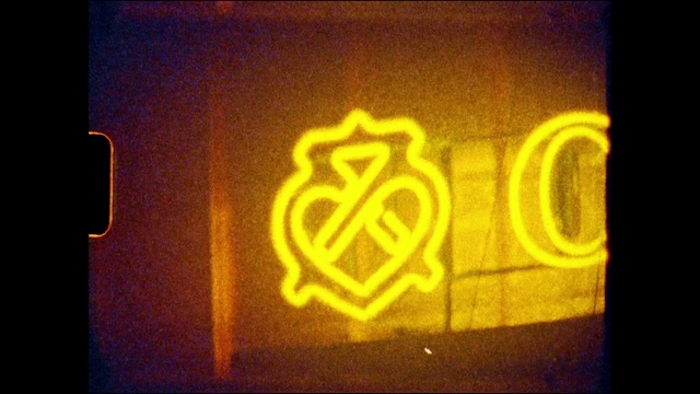 Video Reference: Automotive lighting, Amber, Font, Art, Gas, Tints and shades, Heat, Creative arts, Signage, Graphics